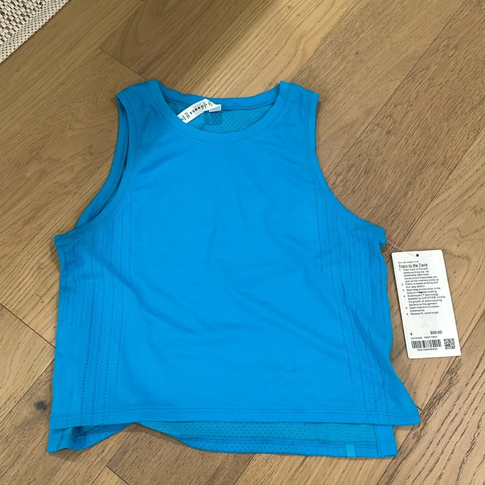 Lululemon train to be top in turquoise  size 4 brand new with tags, never worn